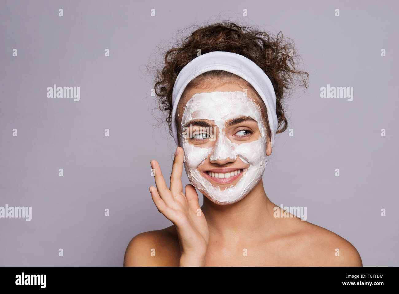 A portrait of a young woman with mask in a studio, beauty and skin care. Stock Photo