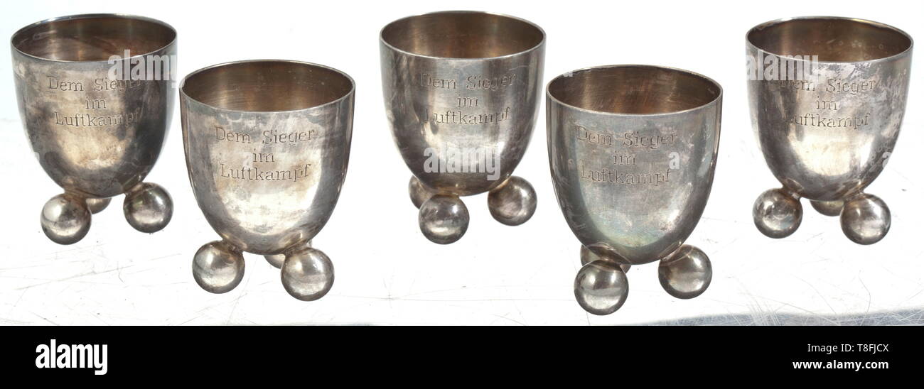 Five victory beakers of JASTA 11 Silver-plated, semi-elliptical cups (WMF) on ball feet, each engraved with 'Dem Sieger im Luftkampf' and 'Jasta 11'. Height of each 5 cm. Some of the most successful fighter pilots of the First World War served in the legendary JASTA 11 (Richthofen, Almenröder, Wolff). historic, historical, troop, troops, armed forces, military, militaria, army, wing, group, air force, air forces, 20th century, Editorial-Use-Only Stock Photo