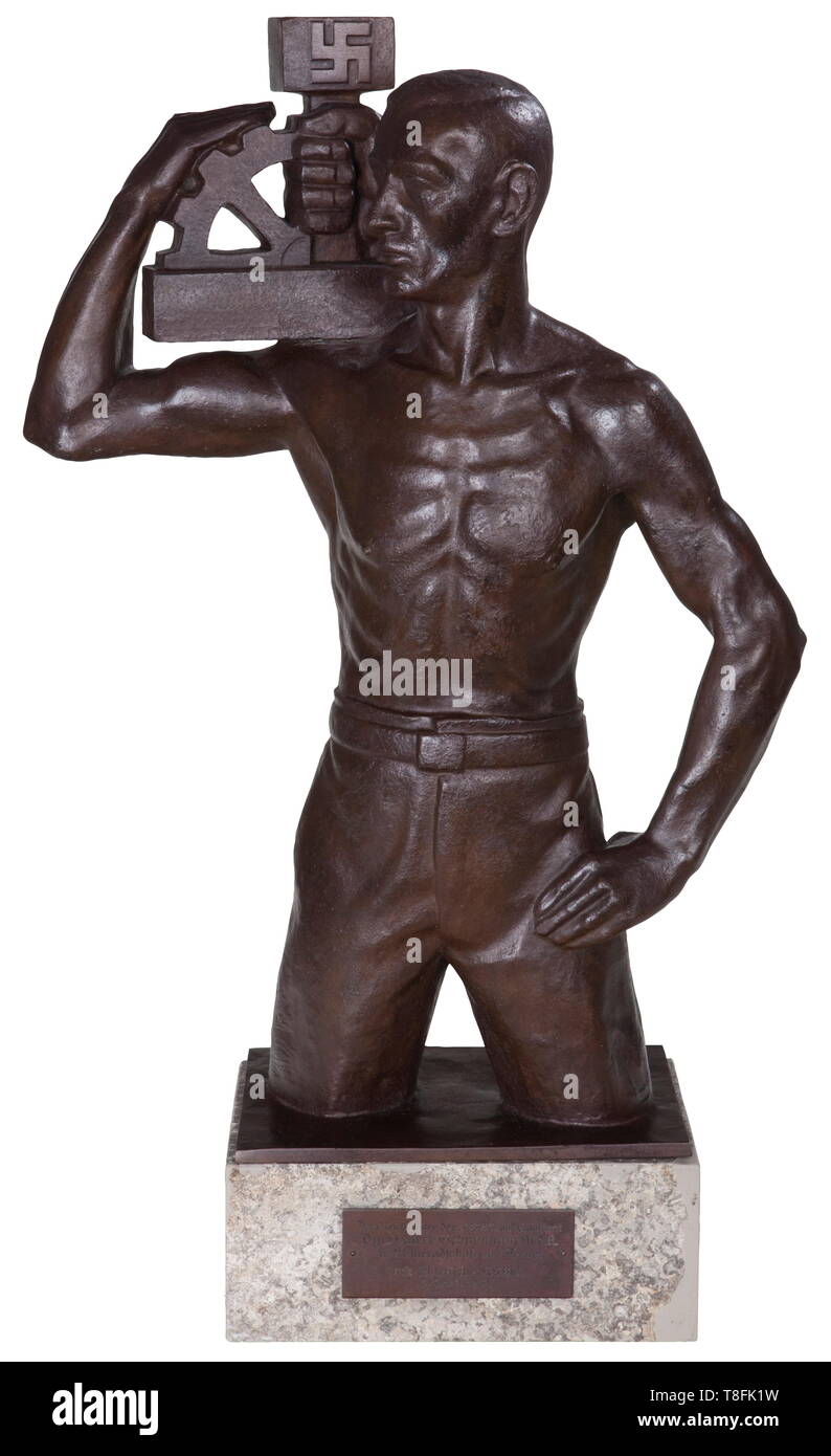 Karl Gayer (1898 - 1969) - early NSBO presentation bronze sculpture by the Breslau sculptor. Large bronze figure, well-modelled, very strong. Marble base with attached dedication plaque, 'Dem Reichsleiter der NSBO und Staatsrat Pg. Walter Schuhmann M.d.R. In Kameradschaft und Treue! Die schlesische NSBO. 3. April 1934.' (To the Reichsleiter of the NSBO and privy council party member Walter Schuhmann MdR (Member of the Reichstag) in comradeship and faithfulness. The Silesian NSBO 3. April 1934.) Signed, dated, foundry-marked. Professional restoration to marble base and figur, Editorial-Use-Only Stock Photo