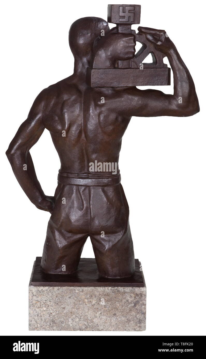 Karl Gayer (1898 - 1969) - early NSBO presentation bronze sculpture by the Breslau sculptor. Large bronze figure, well-modelled, very strong. Marble base with attached dedication plaque, 'Dem Reichsleiter der NSBO und Staatsrat Pg. Walter Schuhmann M.d.R. In Kameradschaft und Treue! Die schlesische NSBO. 3. April 1934.' (To the Reichsleiter of the NSBO and privy council party member Walter Schuhmann MdR (Member of the Reichstag) in comradeship and faithfulness. The Silesian NSBO 3. April 1934.) Signed, dated, foundry-marked. Professional restoration to marble base and figur, Editorial-Use-Only Stock Photo