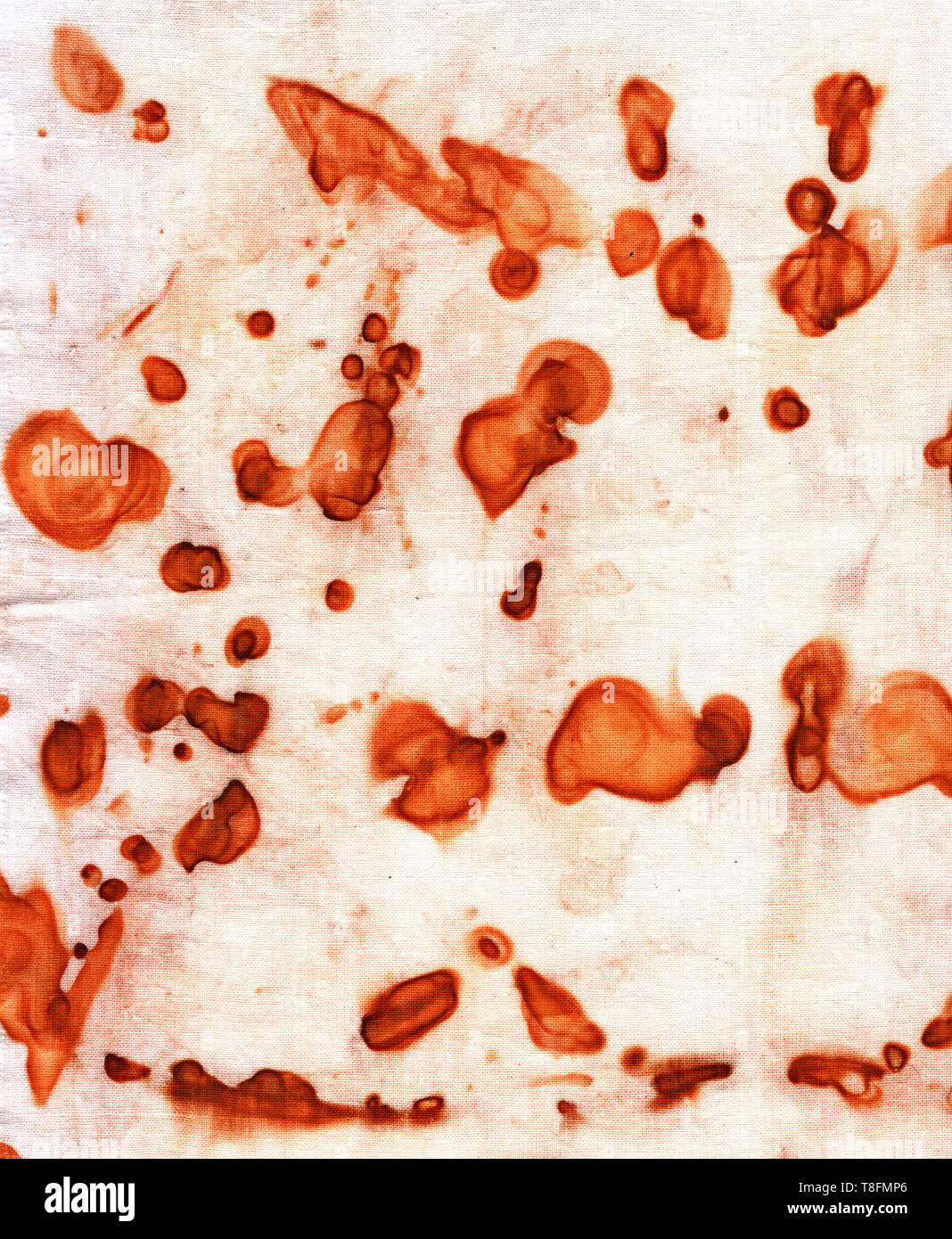 Rusty spots on white cloth. Smooth smoky contours, bright rust color ...