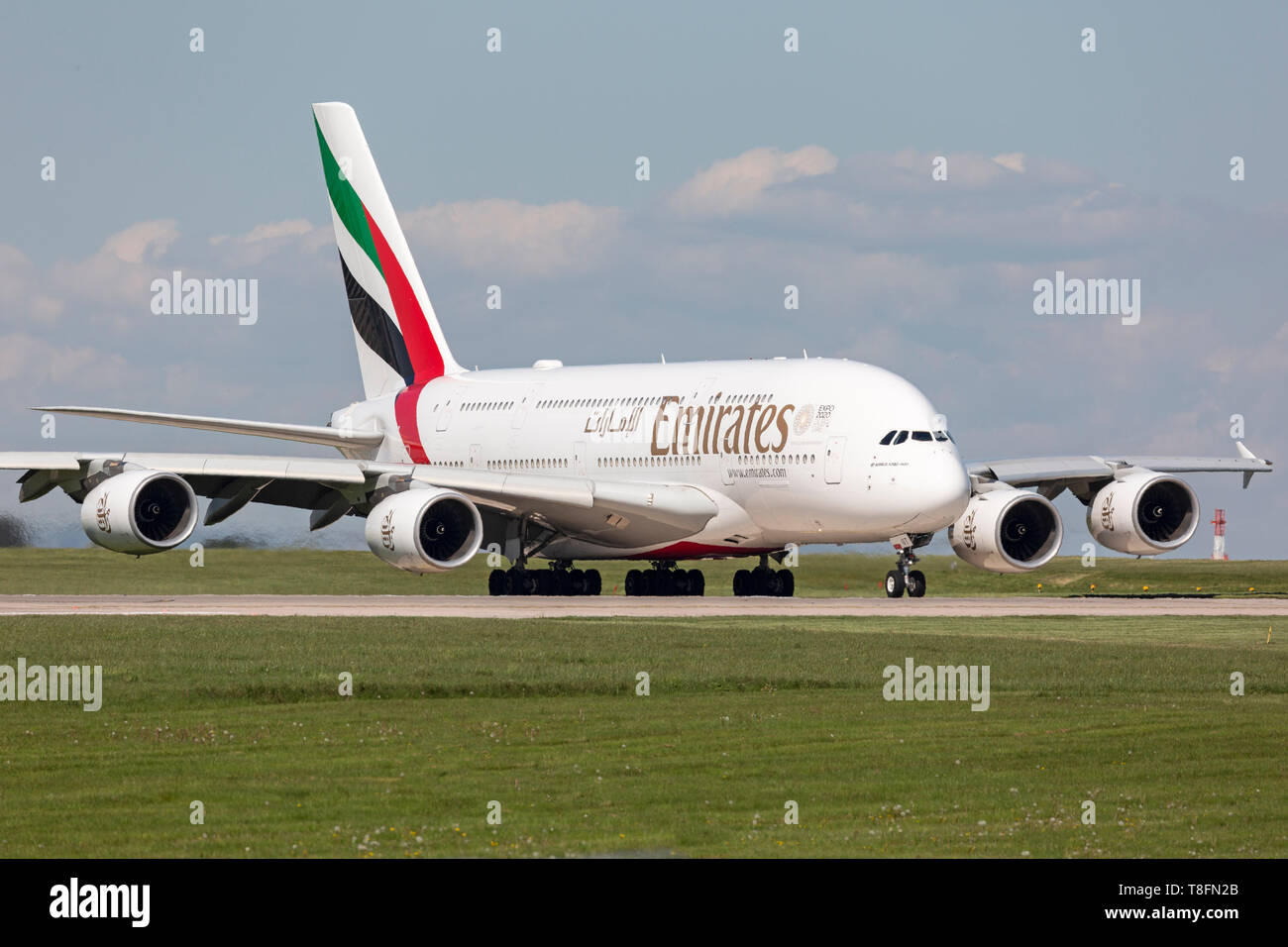 An Emirates Airbus A380, registration A6-EUT, preparing for take off from Manchester Airport, England. Stock Photo