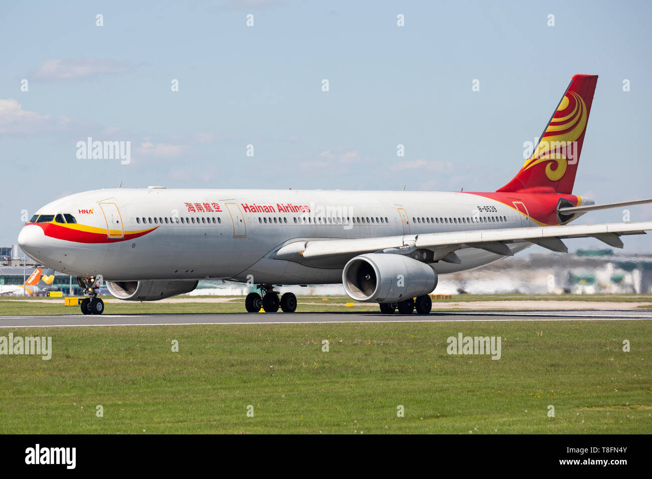 A Hainan Airlines of China Airbus A330, registration B-6539 preparing to take off from Manchester Airport, England. Stock Photo
