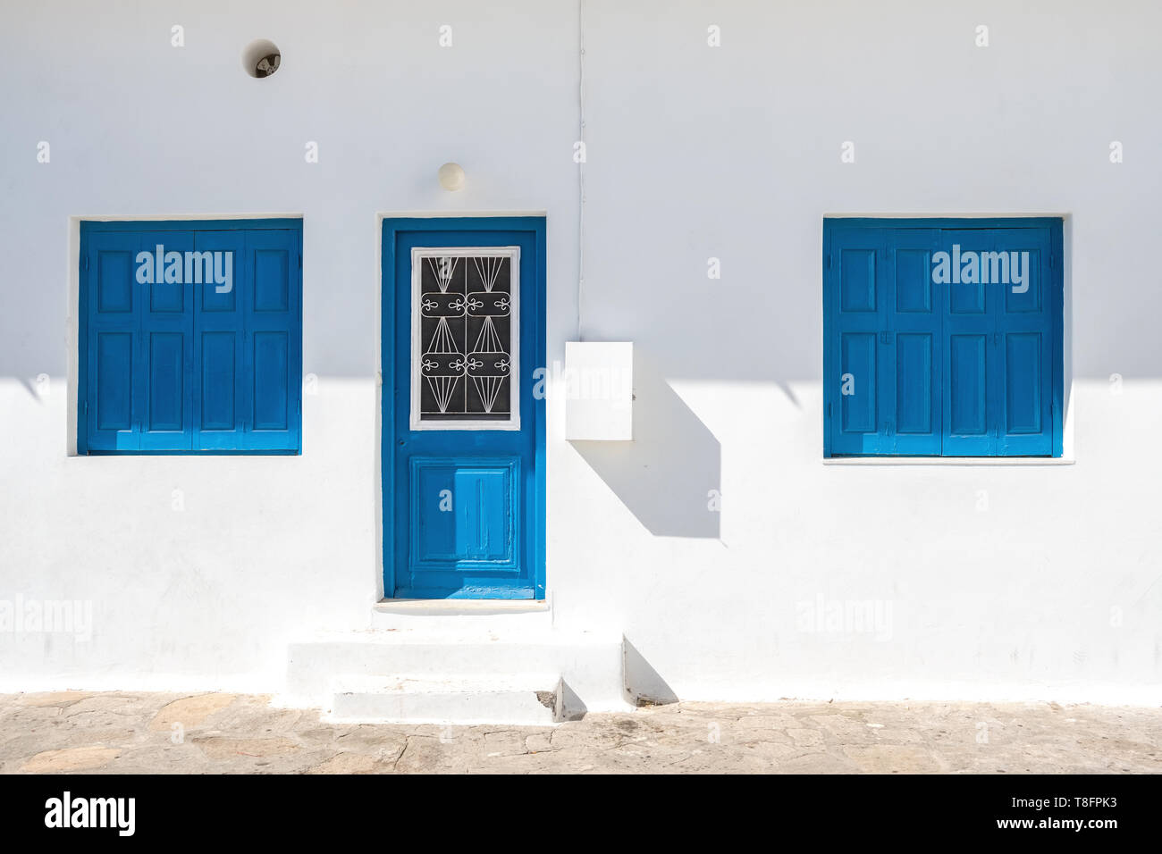 Blue white greek village door hi-res stock photography and images - Alamy