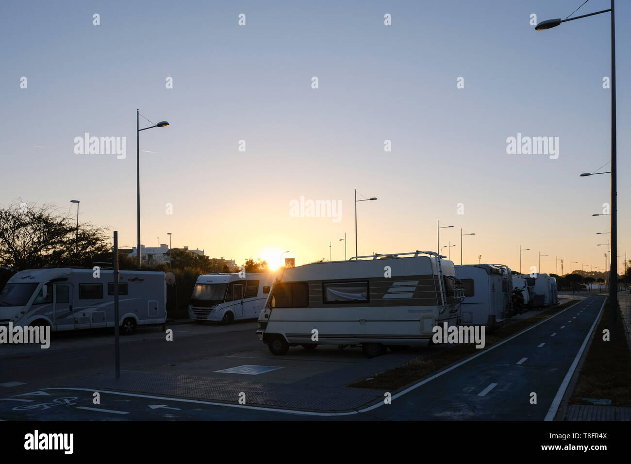 View at sunrise of municipal motorhome parking area, Rota, Andalucía, Spain. Stock Photo