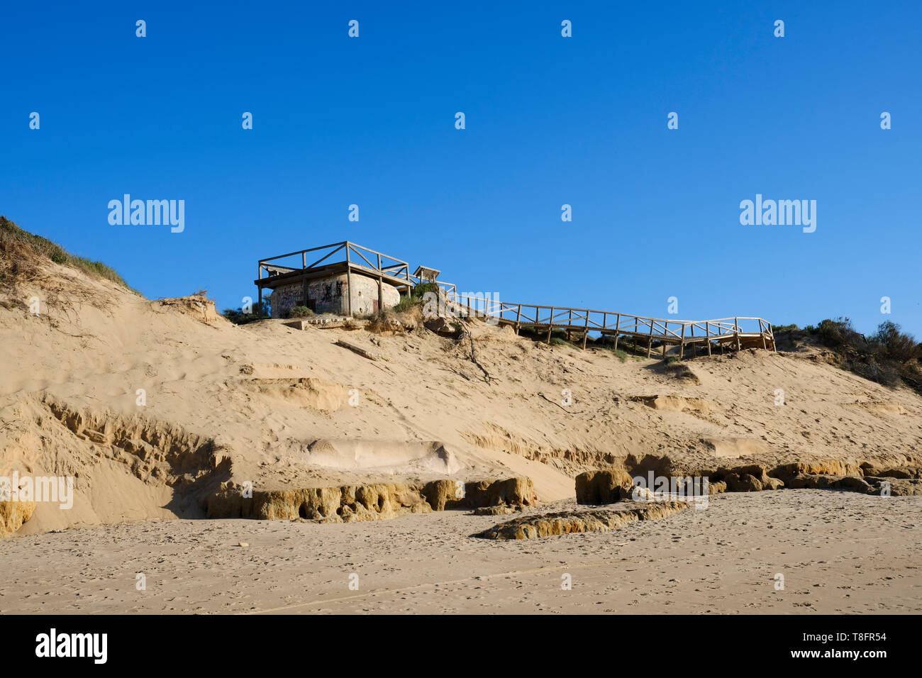 A viewing platform has been built on top of wartime coastal lookout bunkers at Playa Rota beach, Rota, Andalucía, Spain. Stock Photo