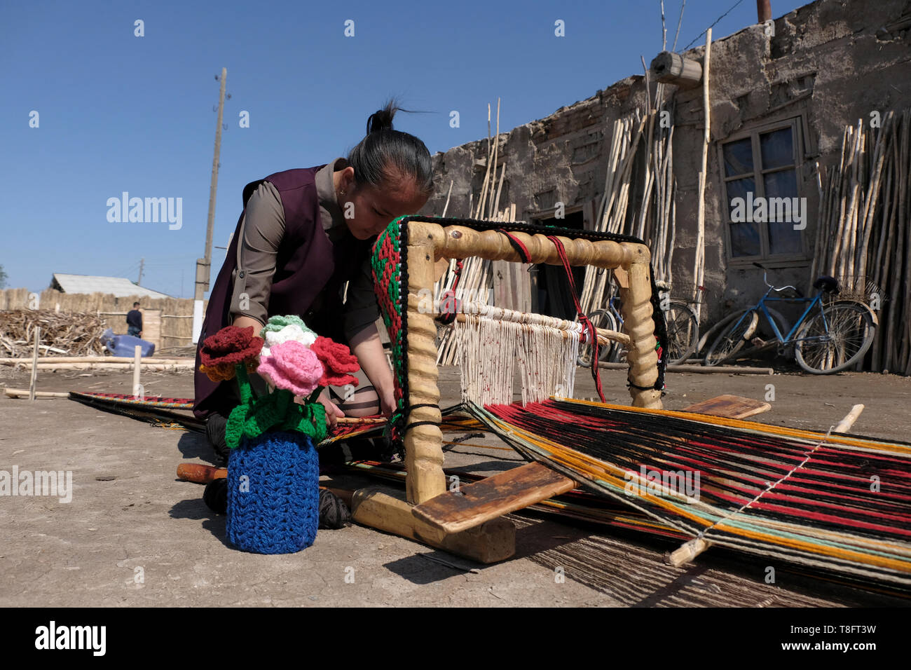 Uzbek Woman Weaving Decorations And Bands For Yurts In A Small