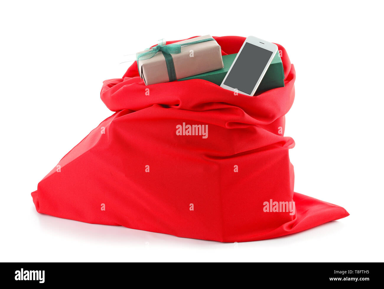 Santa Claus bag full of gifts on white background Stock Photo - Alamy