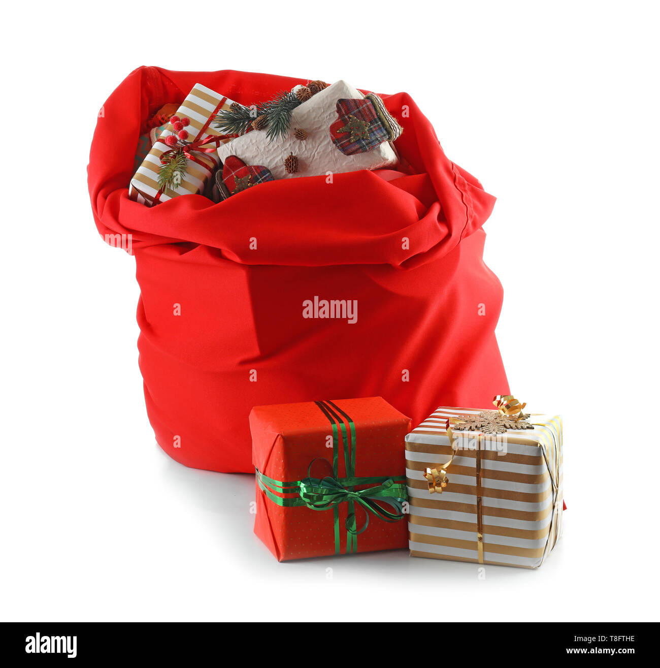 Santa Claus bag full of gifts on white background Stock Photo - Alamy