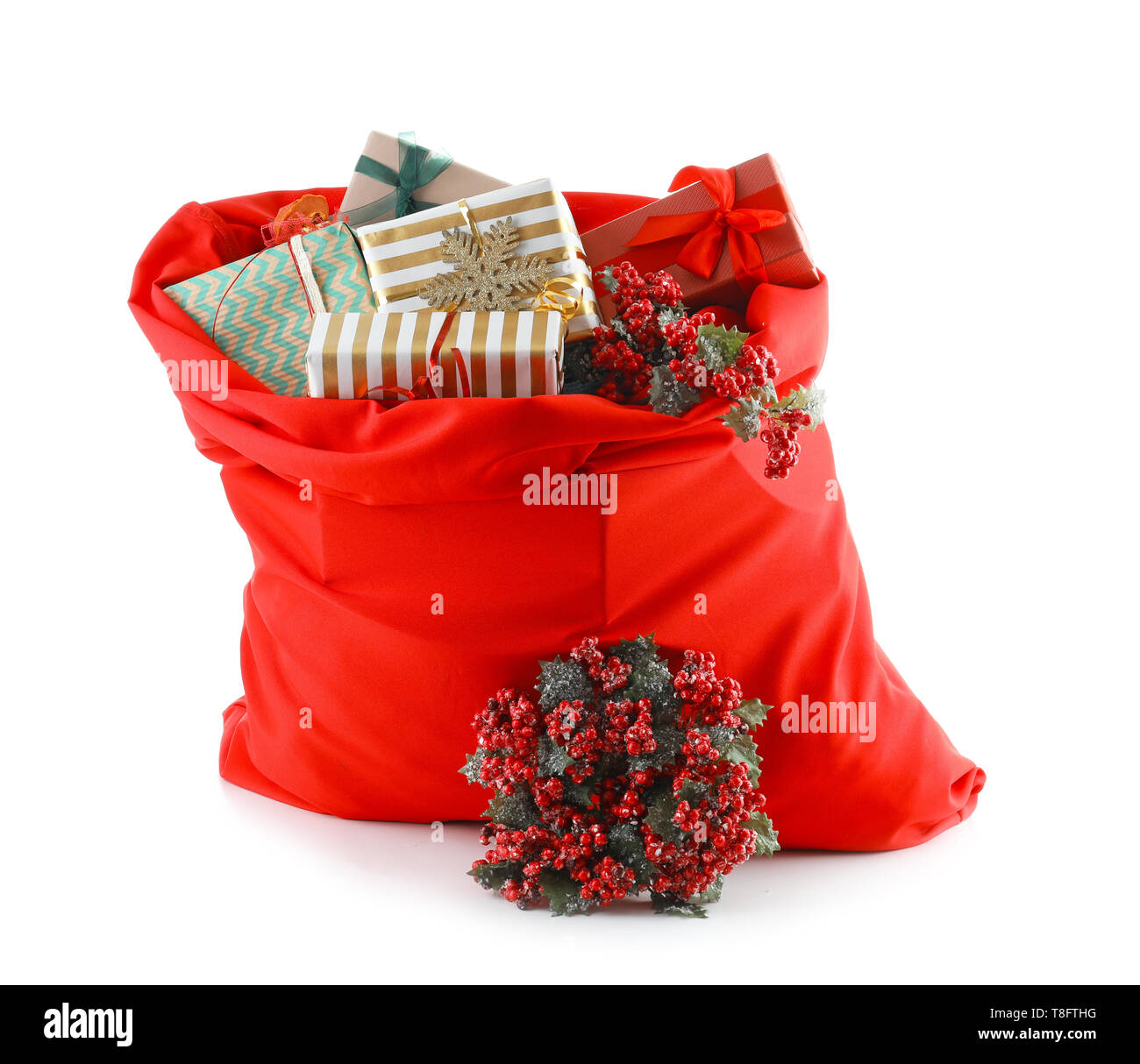Santa Claus bag full of gifts on white background Stock Photo - Alamy