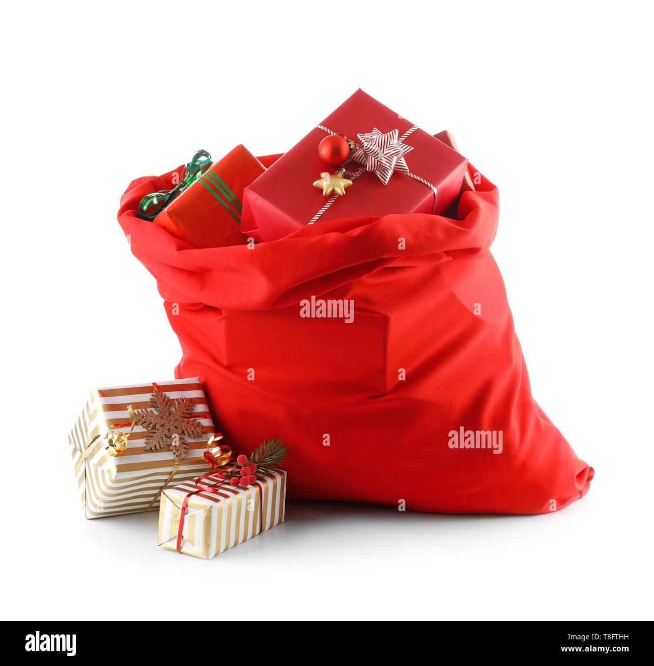 Santa Claus bag full of gifts on white background Stock Photo - Alamy