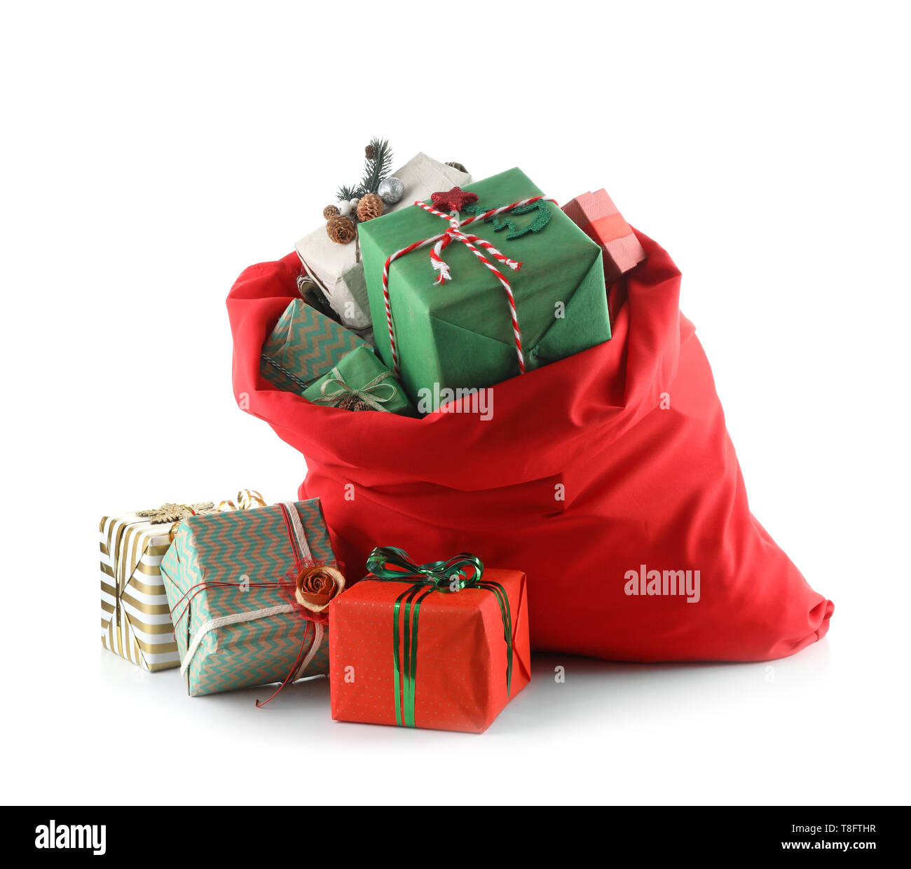 Santa Claus bag full of gifts on white background Stock Photo - Alamy