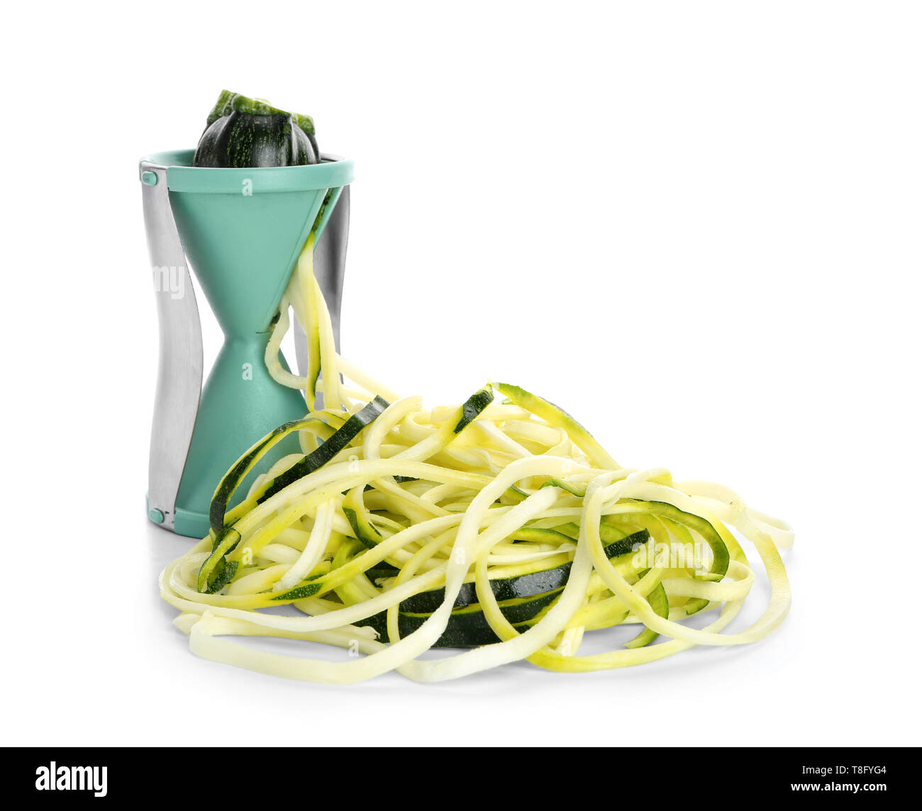 Fresh zucchini spaghetti with spiral grater isolated on white Stock