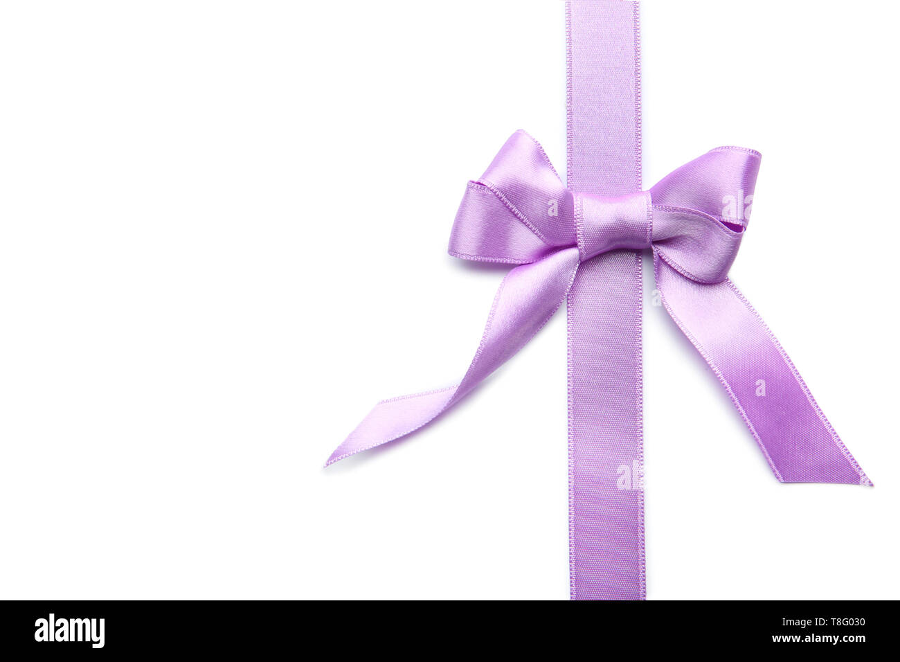 Purple ribbon with bow on white background Stock Photo - Alamy