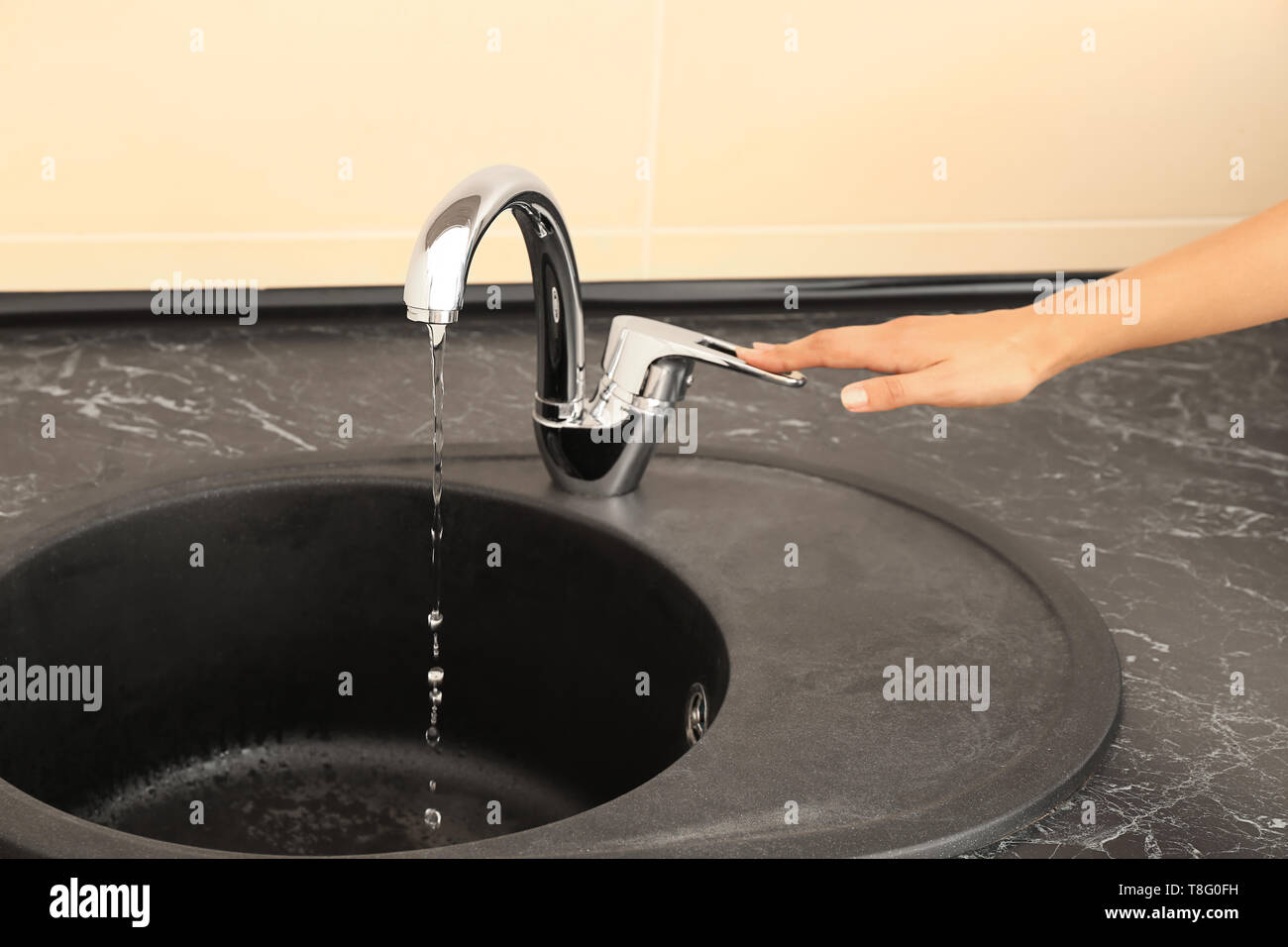 Turning off water tap hires stock photography and images Alamy