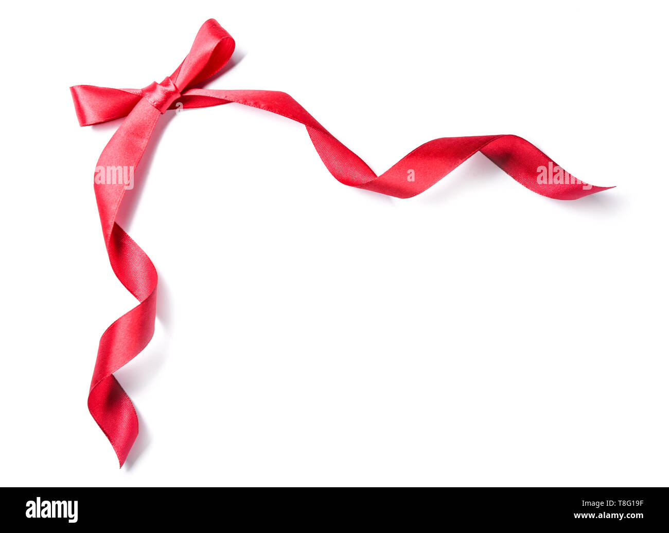 Beautiful red ribbon with bow on white background Stock Photo - Alamy