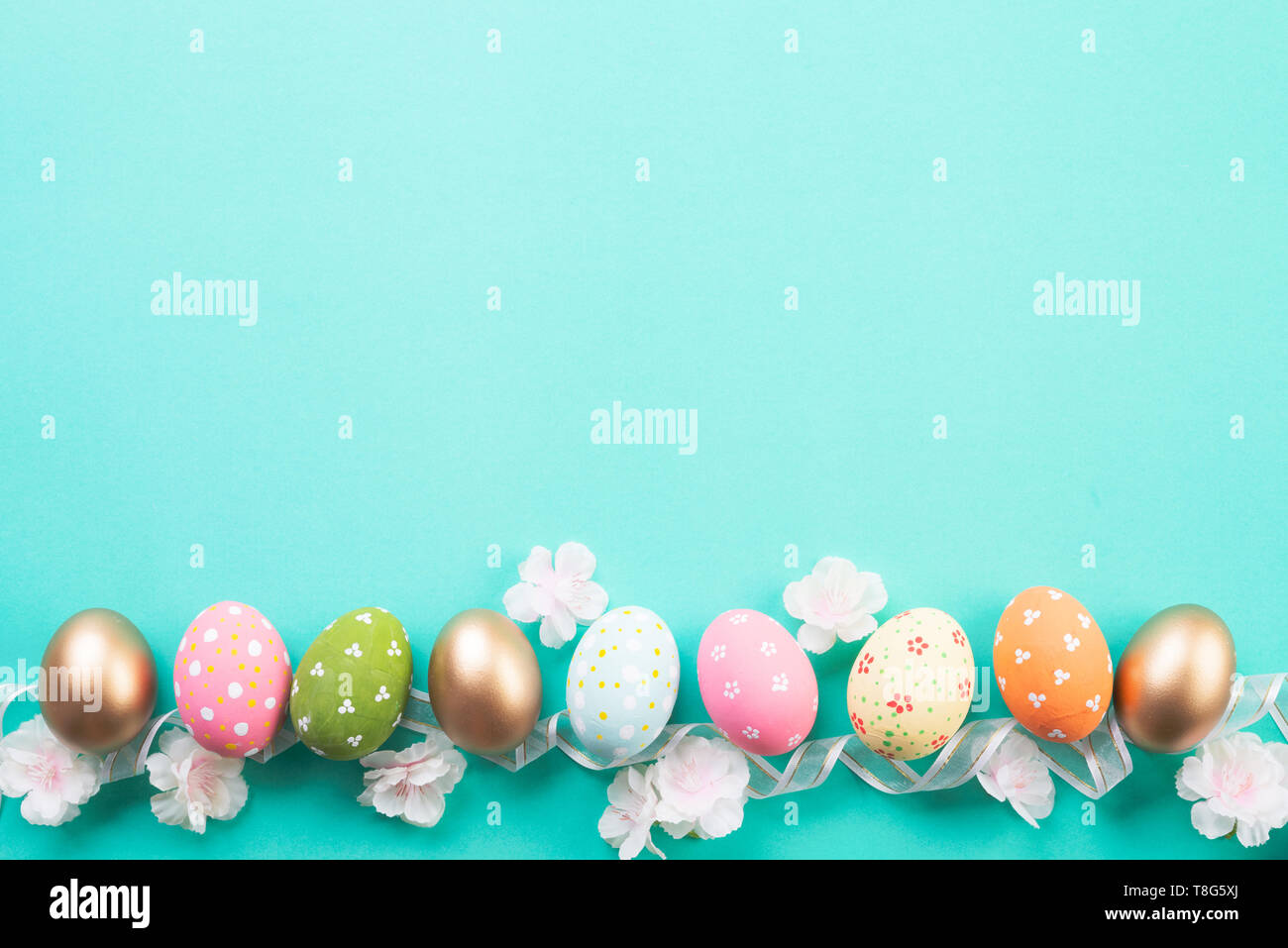 Happy easter! Row Easter eggs on green pastel background Stock Photo ...