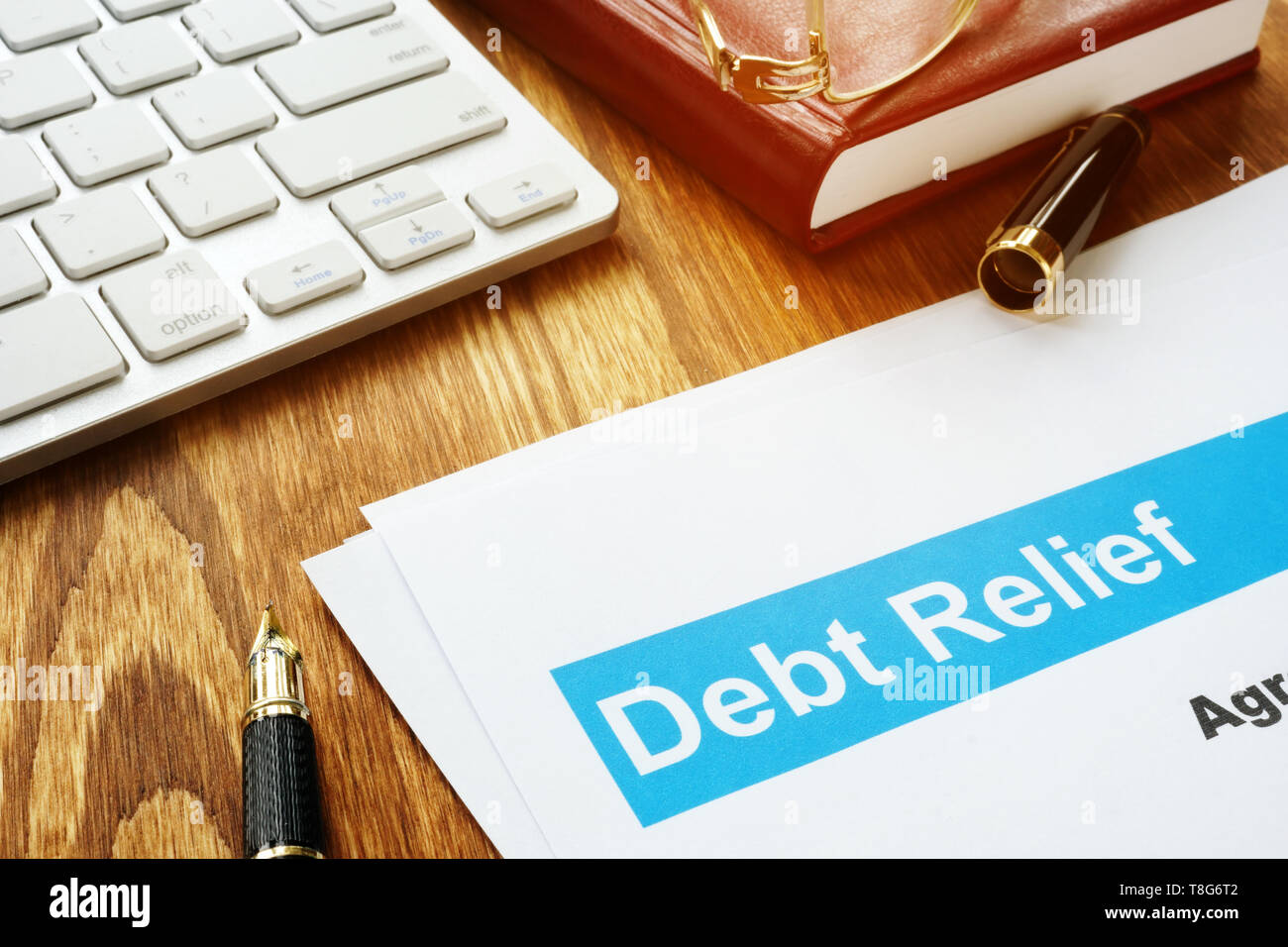 Debt relief agreement in an office on a desk Stock Photo Alamy