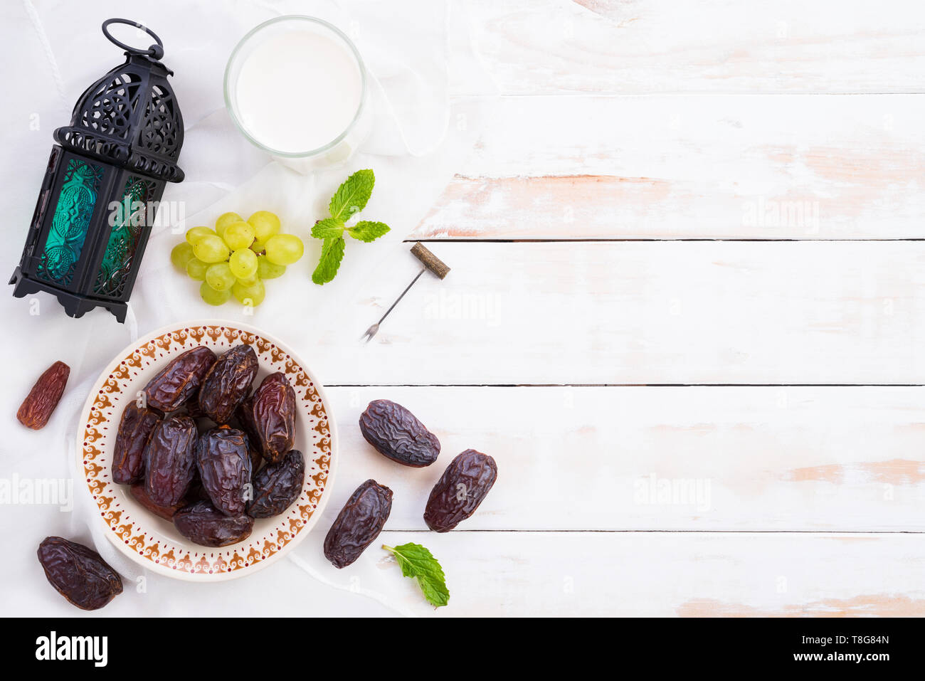 Ramadan food and drinks concept. Ramadan Lantern with Milk, dates fruit ...