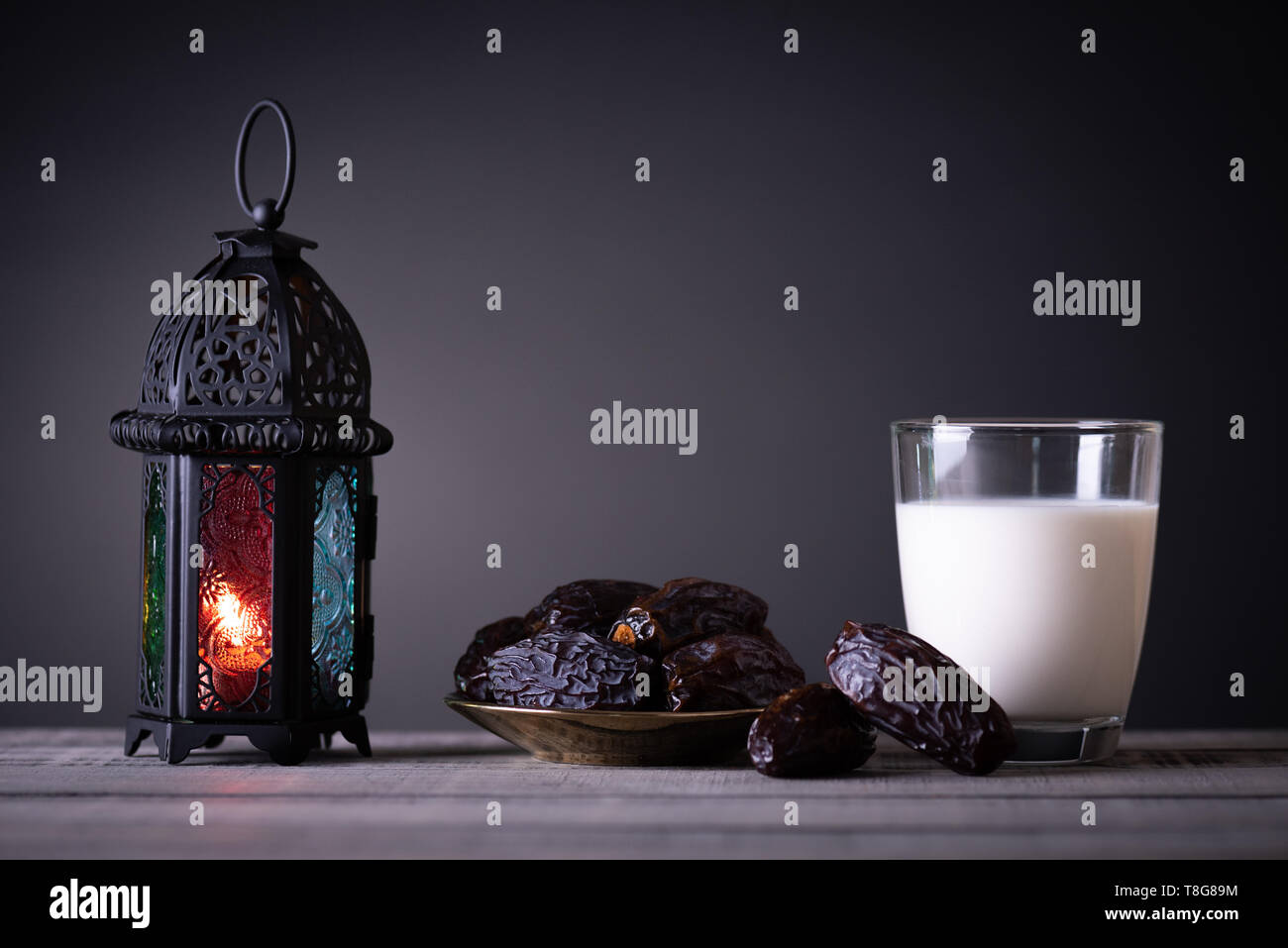 Ramadan food and drinks concept. Ramadan Lantern with Milk, dates fruit ...