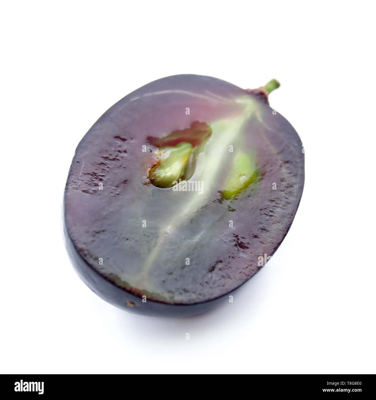 Half of fresh ripe grape on white background Stock Photo - Alamy