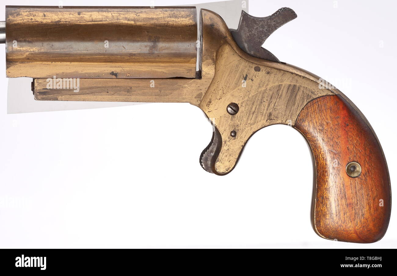 A signal pistol mod. VERY 1877, 'Pistole zum Werfen von Feuerwerkskörpern'/ (tr) 'pistol for throwing fireworks' Cal. 1, no. 31. Matching numbers. Bright bore in revolving barrel, length 100 mm. On right side of frame three-line marking 'VERYÂ´S PATENT / Dyer & Robson / Greenwich'. Revolving barrel lock with barrel loadable from both ends. Barrel held by two spring-mounted pins. Manufactured in bronze, here as a presentation weapon with faded gilding. Steel operational and small parts. Smooth teak grip panels. Extremely rare collector's item. Dev, Additional-Rights-Clearance-Info-Not-Available Stock Photo