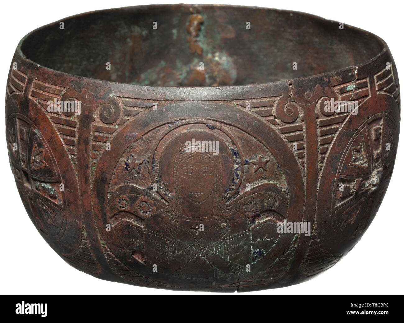 A Byzantine engraved and enamelled node, 10th - 12th century AD Bronze with black-brown pyre patina. Curved, round body with continuous, finely engraved depiction of Christ and Mary, each amid cross and pillar motifs. The engravings with remnants of multi-coloured enamel. Several cracks and two larger defects. Diameter 14 cm. Sophisticated and probably originally gilt part of a cup or the like. historic, historical, middle ages, Additional-Rights-Clearance-Info-Not-Available Stock Photo