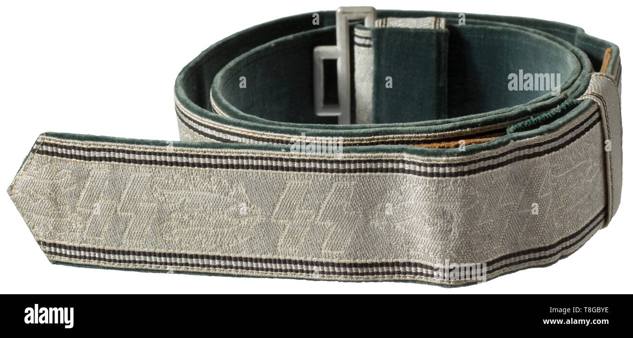 A waist belt for officers Silver brocade with woven-in runes between oak leaf branches, doubled, black edge trim, dark green velvet liner with glued-on SS RZM tag '009004 - 167'. Complete with both loops and aluminium buckle for police officers stamped 'DRGM'. Cf. lot no. 7189 from Auction 57. Minimal signs of age. Extraordinarily rare in this state of preservation. historic, historical, 20th century, 1930s, 1940s, Waffen-SS, armed division of the SS, armed service, armed services, NS, National Socialism, Nazism, Third Reich, German Reich, Germany, military, militaria, uten, Editorial-Use-Only Stock Photo