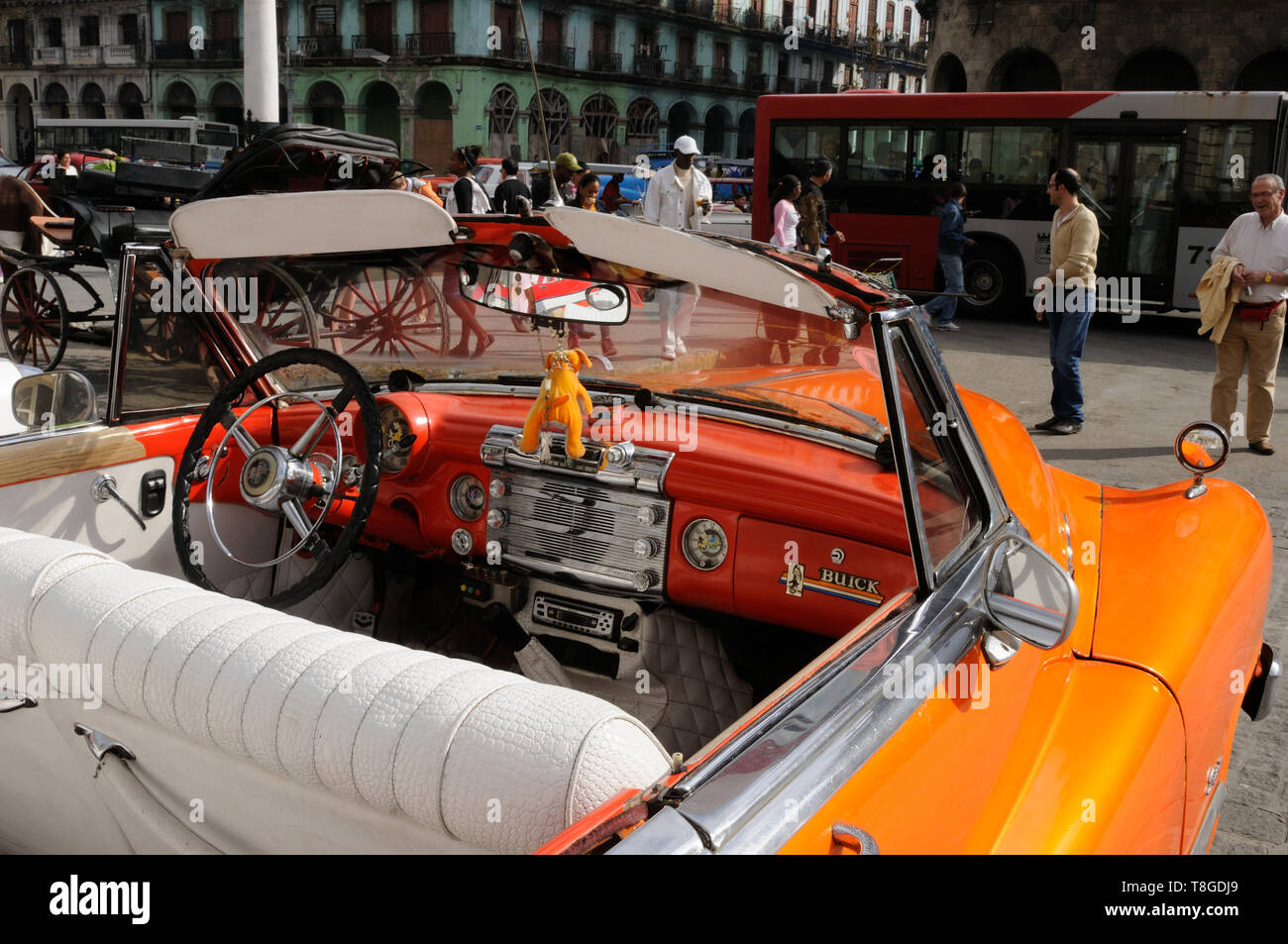 Cuba: Orange Buick Oldtimer in front of the capitolio in the capital city Havanna Stock Photo