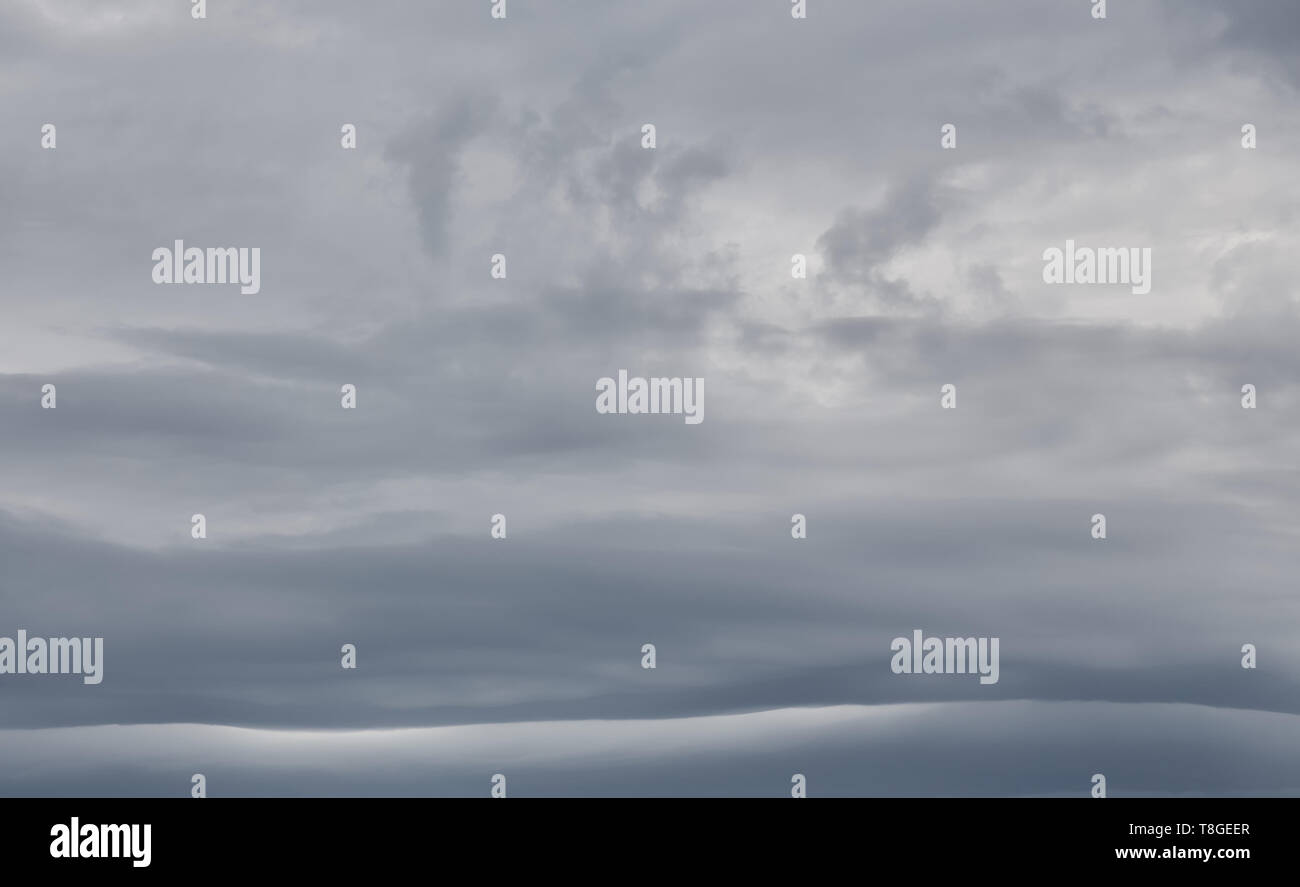 Storm sky background with dark clouds. Stock Photo