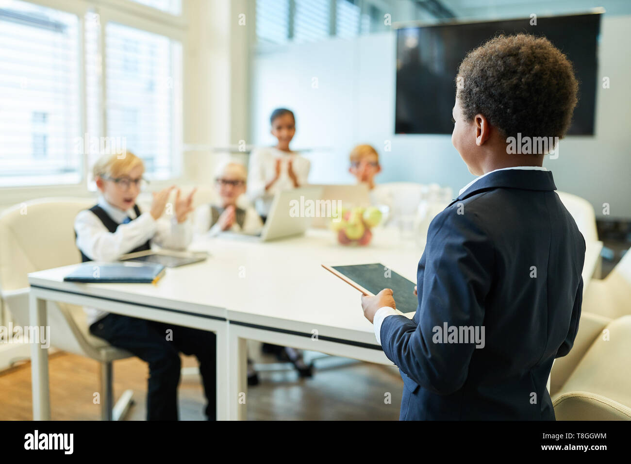 Young as a speaker or business consultant in a consulting workshop in a meeting Stock Photo