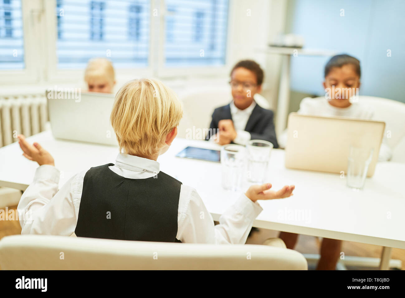 Children as business people and job applicants in a job interview Stock Photo