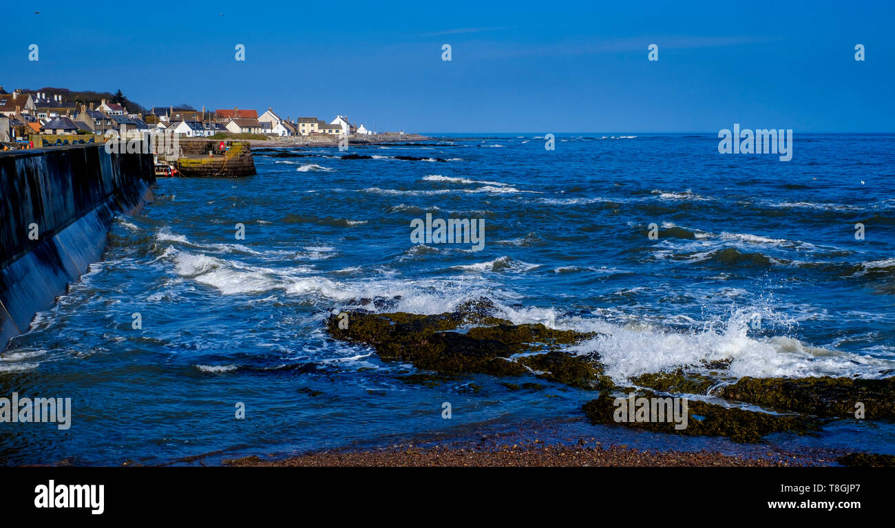 Rocks outside the harbour at the coastal village of Johnshaven in