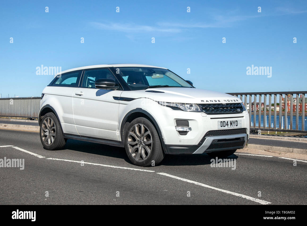 White 2013 Land Rover Range Rover Evoque Dynamic on the seafront promenade, Southport, Merseyside, UK Stock Photo