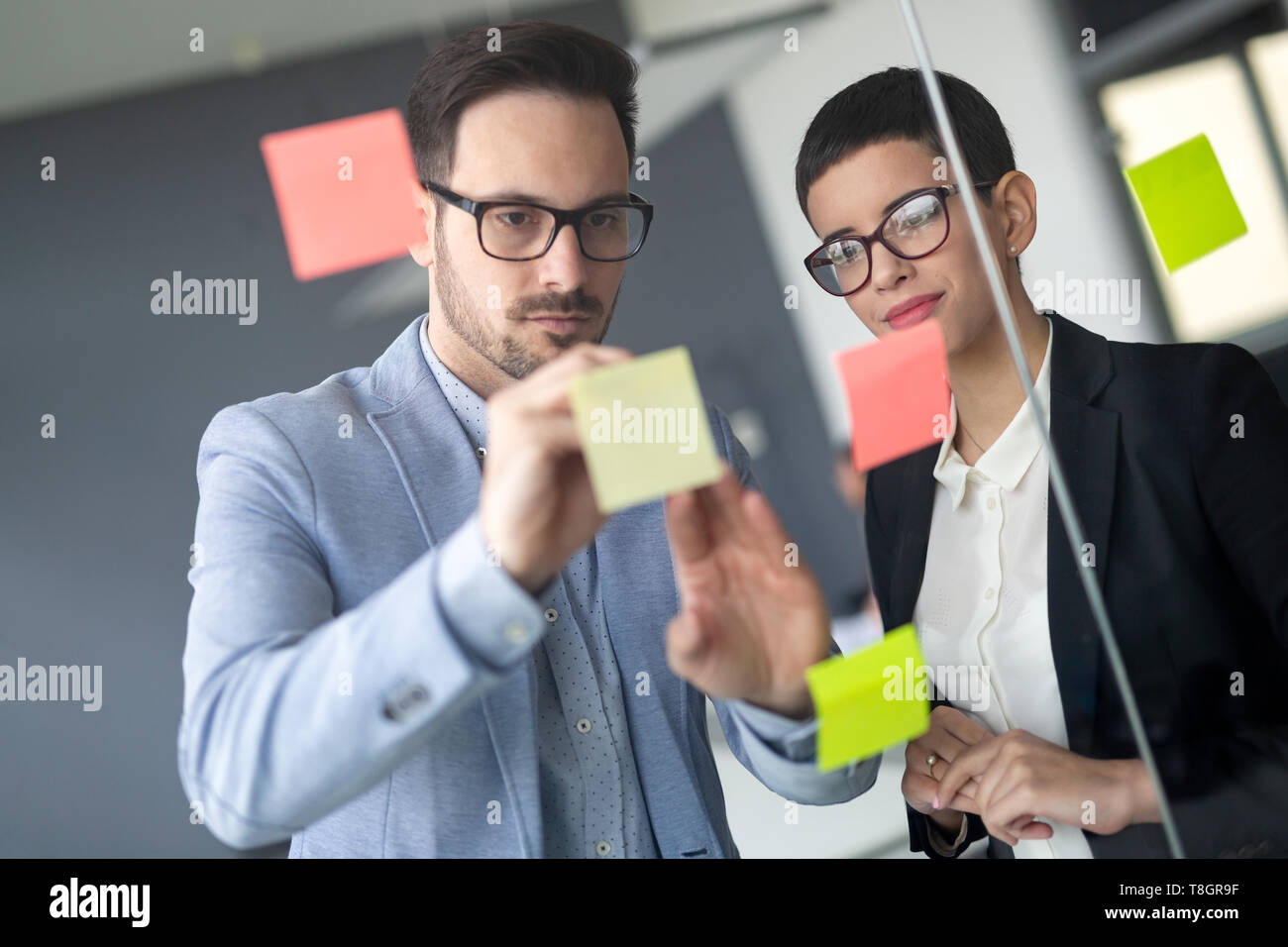 Collaboration and analysis by business people working in office Stock ...