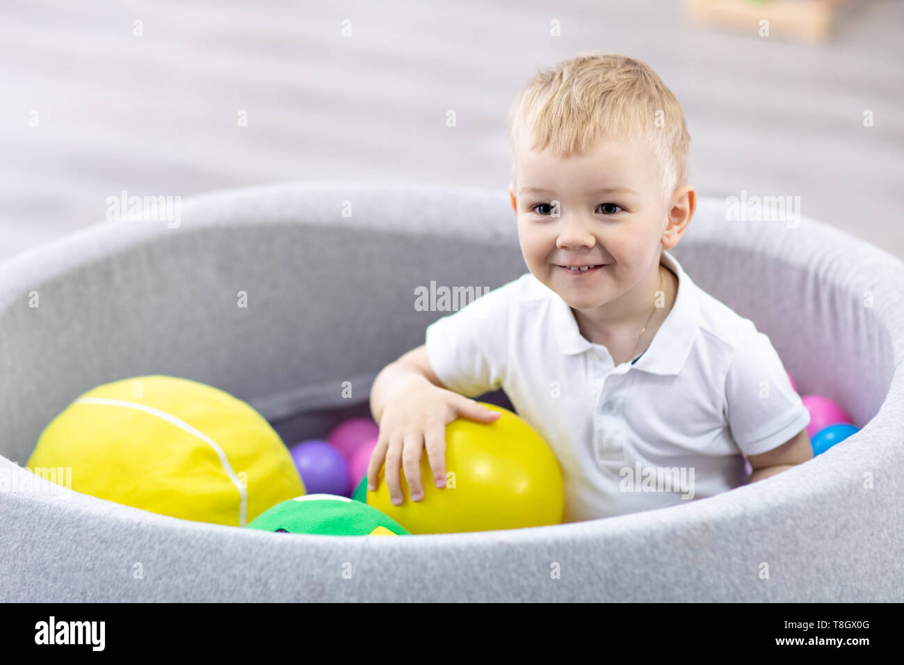Happy Kid Boy Having Fun Indoor In Play Center Child Toddler