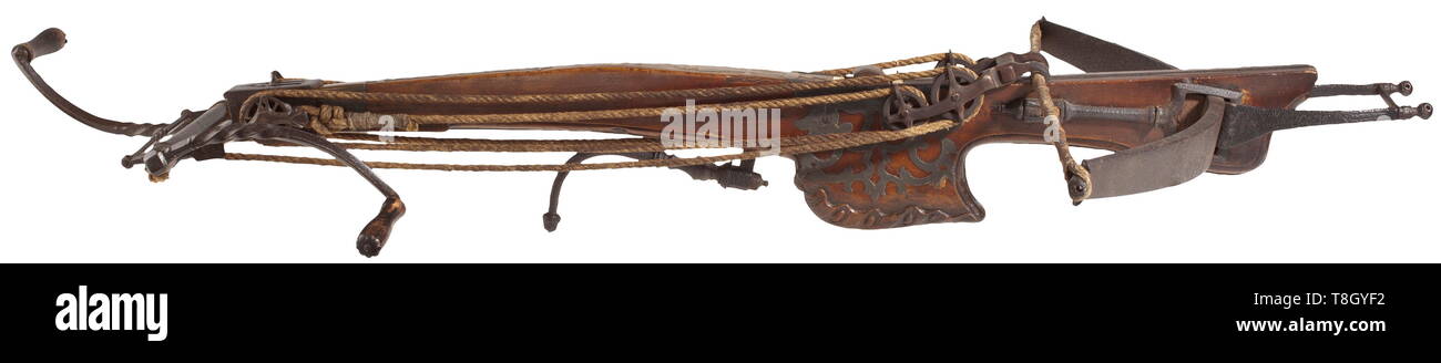 A Heavy Dutch Target Crossbow With Windlass Circa 1700 Robust Forged Steel Bow With Braided Hemp String Iron Bridle And Cut Stirrup Sturdy Walnut Tiller Carved At Bottom With Ornamental Tin Inlays
