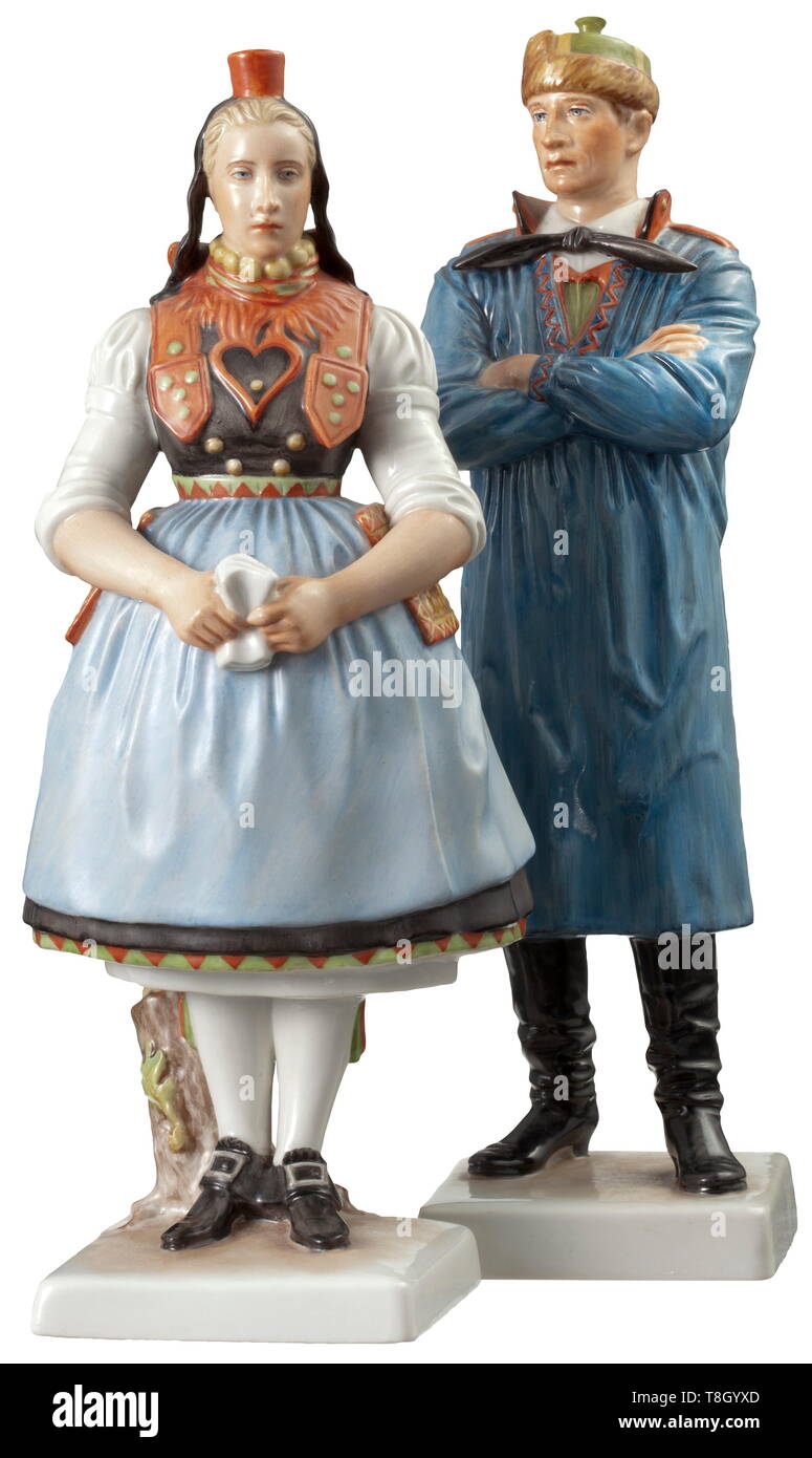 A Hessian peasant couple Design by Richard Förster, model number '53' and '54'. Polychrome glazed porcelain. The artist's signature, model number and manufacture's mark 'SS' impressed into the base. Female figure with minimal restoration under the right knee. Height circa 22.5 cm and 23 cm. Extremely rare. According to literary references, the polychrome versions were only produced in 1938, 32 copies of the female and 31 copies of the male peasant. Cf. Porell, Allach Porcelain, vol. 2, p. 344. From the estate of the Allach porcelain thrower Hans Schaale. historic, historica, Editorial-Use-Only Stock Photo