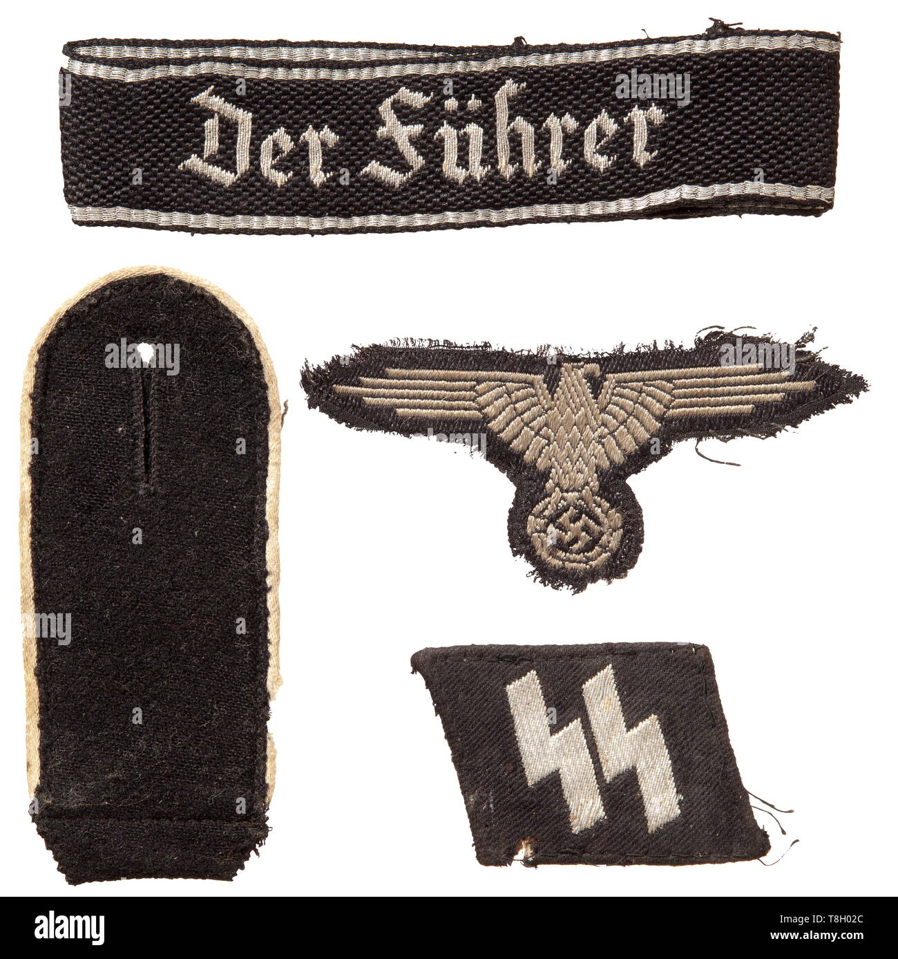 Rottenführer Albin Dunkel, Regiment 'Der Führer' - insignia A cuff title 'Der Führer', 1st model with Gothic script, in silver-woven 'flatwire'-issue for leaders. Used, customized to 36 cm in length, removed from a uniform. A right collar patch with silver-woven SS-runes (flatwire), clearly used with moth damage on reverse. A single shoulder board for enlisted men of the infantry, mothy. A silver-grey woven sleeve eagle (BeVo) on a black base, used and separated from the uniform. historic, historical, 20th century, 1930s, 1940s, Waffen-SS, armed division of the SS, armed se, Editorial-Use-Only Stock Photo