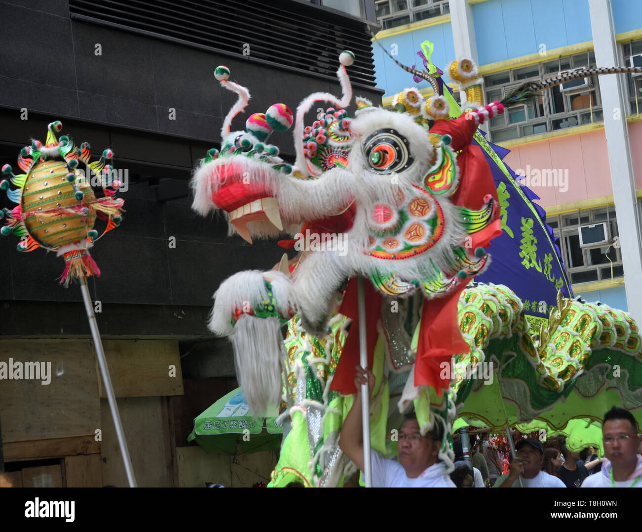 Traditional Chinese Dragon dance on street to celebrate Tam Kung Festival, Hong Kong Stock Photo