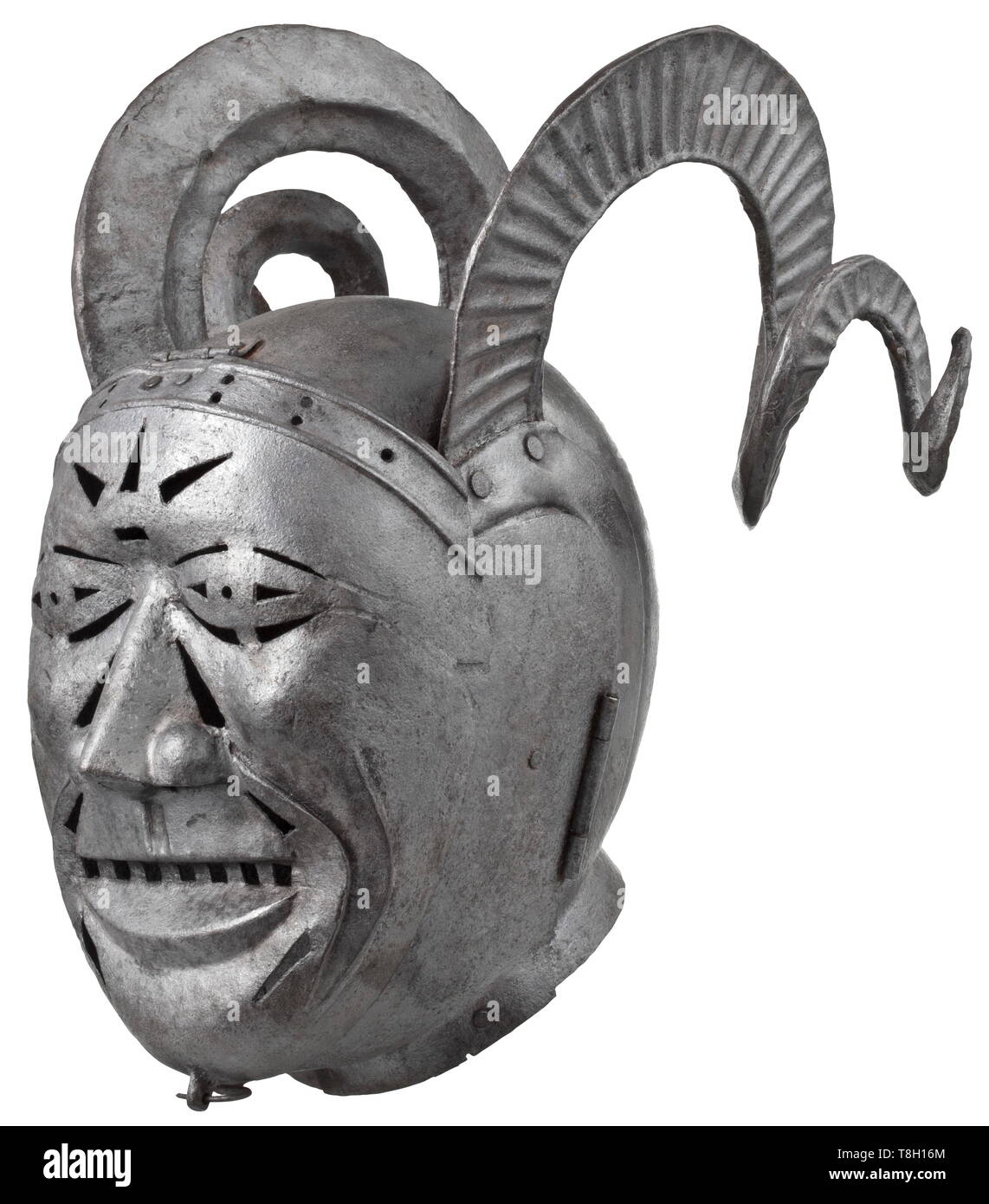 A mask of shame, or brank - collector's reproduction in the style of the 16th century Two-piece iron skull with riveted, spiral-shaped ram's horns. Laterally hinged two-piece bevor. Hinged, geometrically pierced visor in the shape of a face. Somewhat corroded with dark patina. Height ca. 40 cm. This piece was modelled on an armet housed in the Royal Armouries in Leeds today. The famous 'horned helmet' was made between 1511 and 1514 by the Innsbruck armourer Konrad Seusenhofer and was a present from Emperor Maximilian I to the English King Henry V, Additional-Rights-Clearance-Info-Not-Available Stock Photo