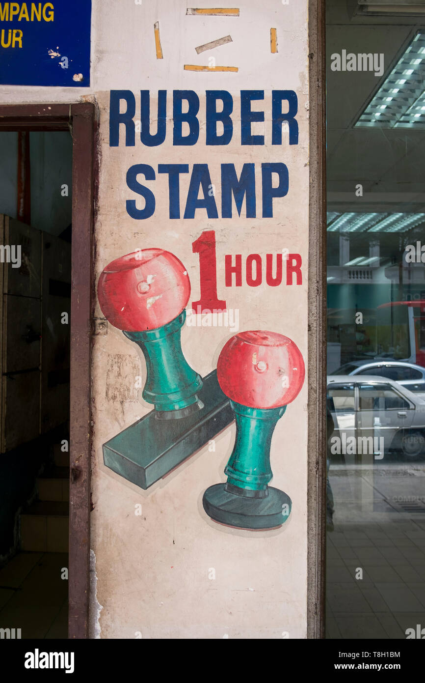 Traditional, hand painted rubber stamp signs at an office supply shop in Kuala Lumpur, Malaysia