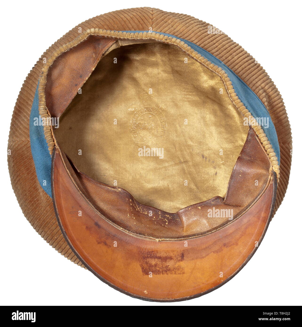 A visor cap for members of the colonial forces in German-South West Africa Brown cord fabric (good condition, slightly darkened), cornflower blue piping and cap band, Reich cockade (topped by a moth hole), black leather visor with slight indentations. In the lid golden inscription of the hat maker's name (v. Tippelskirch & Co. Berlin). Brown leather sweatband, light brown silk lining. Cf. lot 3997 from our 65th auction. With large-size (13 x 18 cm) carte de visite photo with the portrait of the soldier. Extremely rare piece of garment of the colo, Additional-Rights-Clearance-Info-Not-Available Stock Photo