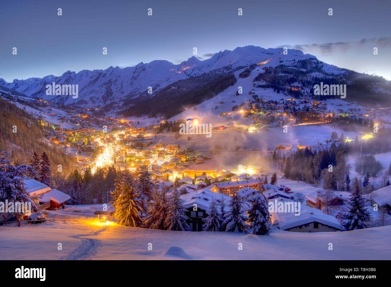 France, Haute Savoie, massif des Aravis, La Clusaz, general view of the  resort with the slopes of the Aiguille ski area at sunrise Stock Photo -  Alamy