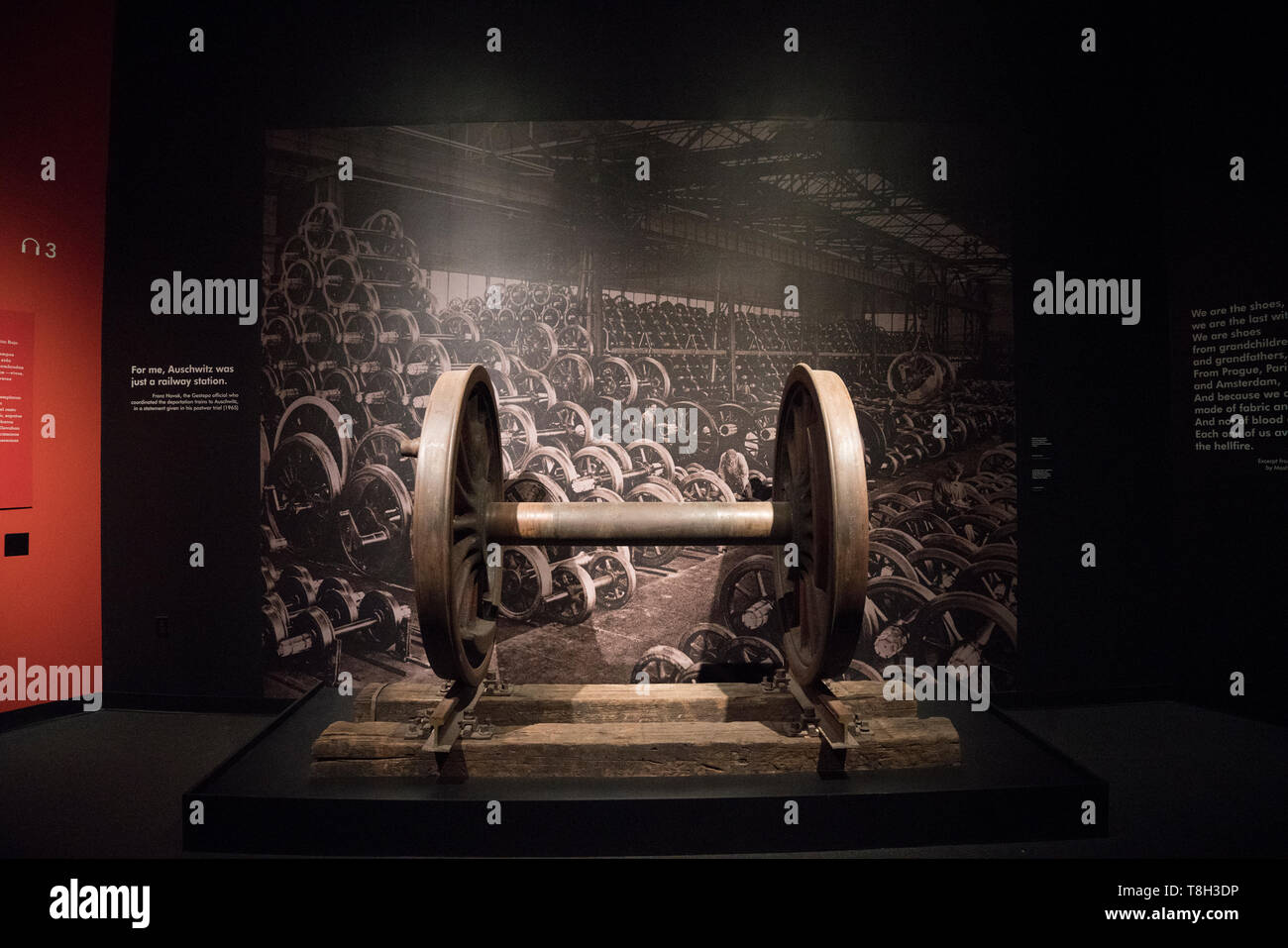In the exhibition “Auschwitz. Not long ago. Not far away” are a set of massive wheels from a freight car like those that took victims to Auschwitz. Stock Photo