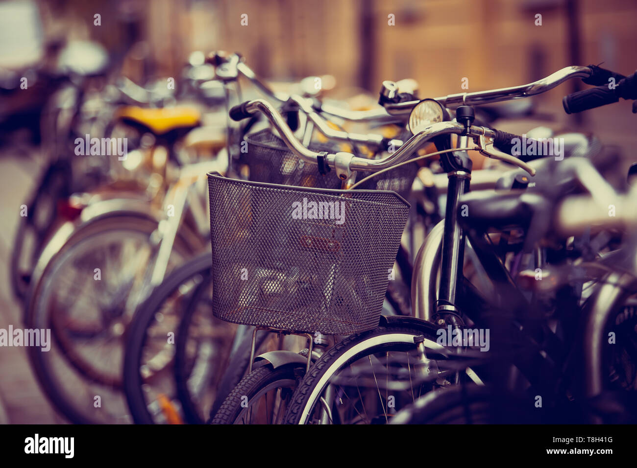 Comfortable Bicycles Parked In European City Street Rent A Bike