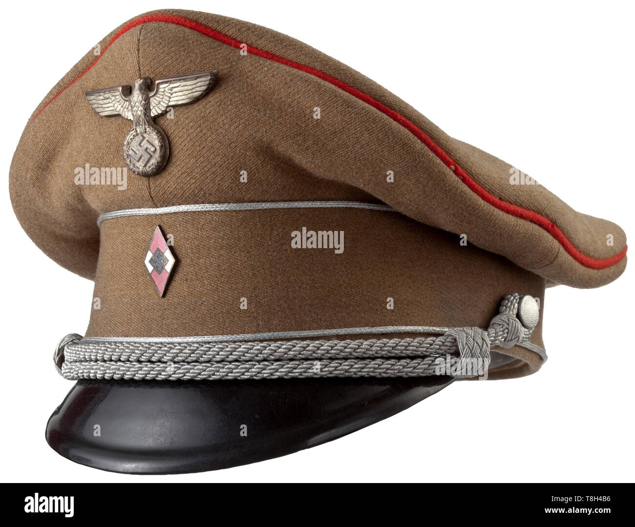 A visor cap for the senior leadership For the ranks of Gefolgschaftsführer (escort leader) and Hauptgefolgschaftsführer (senior escort leader). Brown cotton twill with silver pipings on the cap body and red cover piping (moth traces), silver-plated HJ emblem and leader's eagle, silver cap cord and black lacquered visor. Light yellow silk lining with cellon cap trapezoid (flaw) and RZM tag 'Tuchmütze' under the leather sweatband. historic, historical, 20th century, 1930s, League of German Girls, Band of German Maidens, youth organization, youth organizations, NS, National So, Editorial-Use-Only Stock Photo