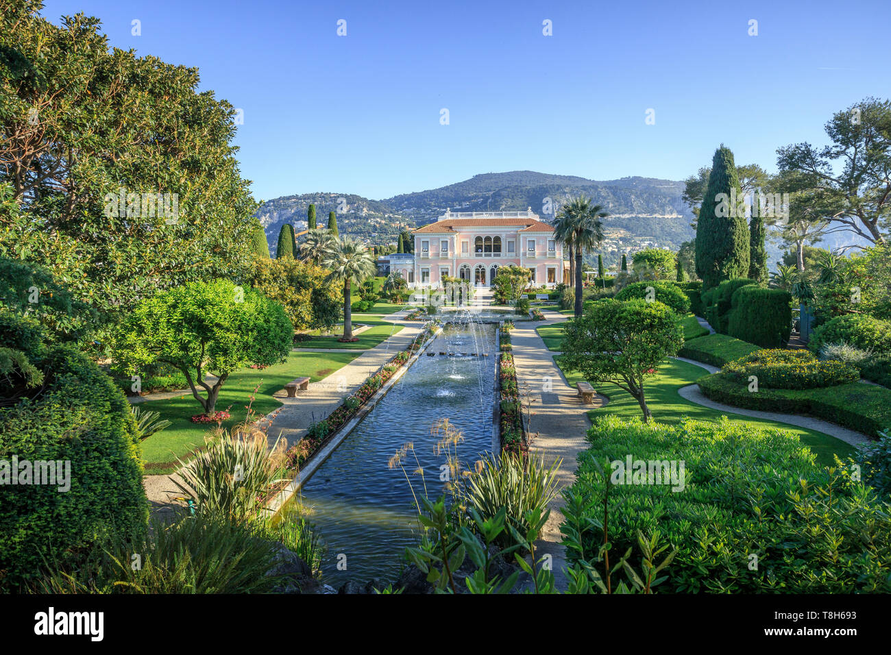 France, Alpes Maritimes, Saint Jean Cap Ferrat, villa and gardens Ephrussi de Rothschild, the French garden, large pond and water jets and view on the Stock Photo