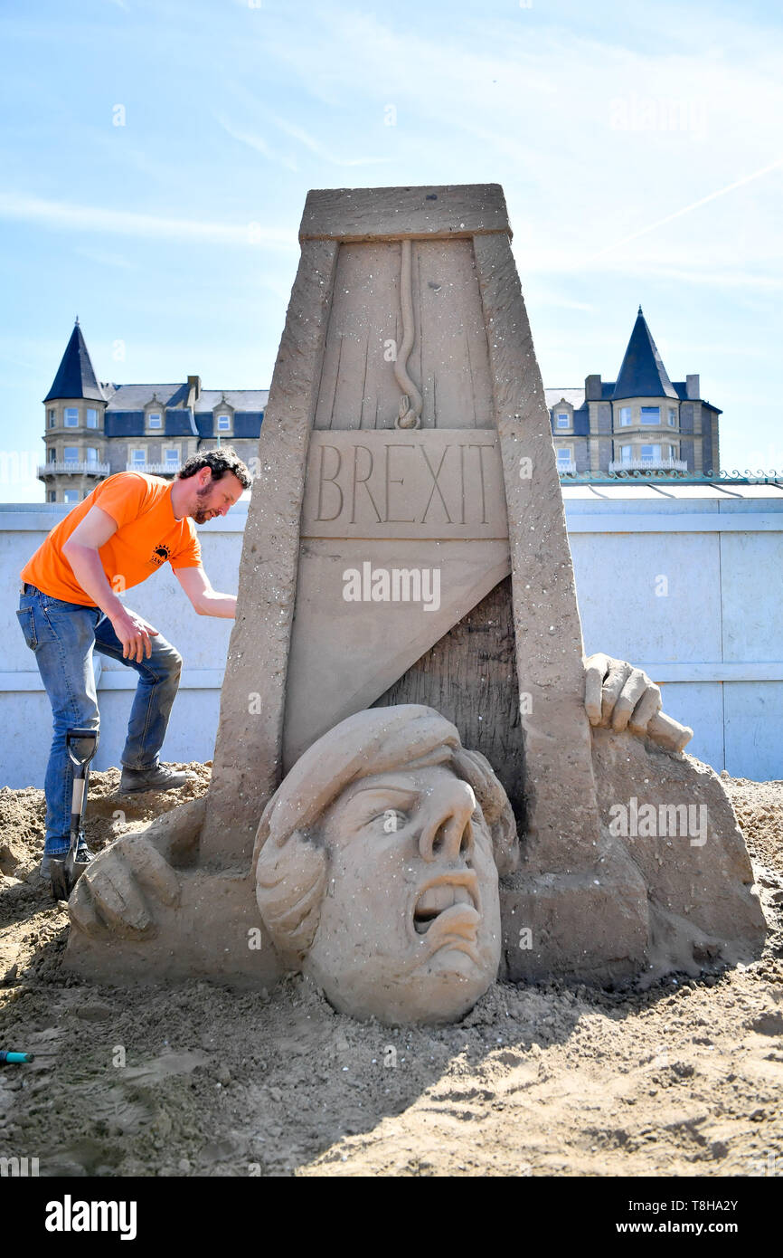 Sand sculpture artist Johannes Hogebrink works on a Brexit themed ...