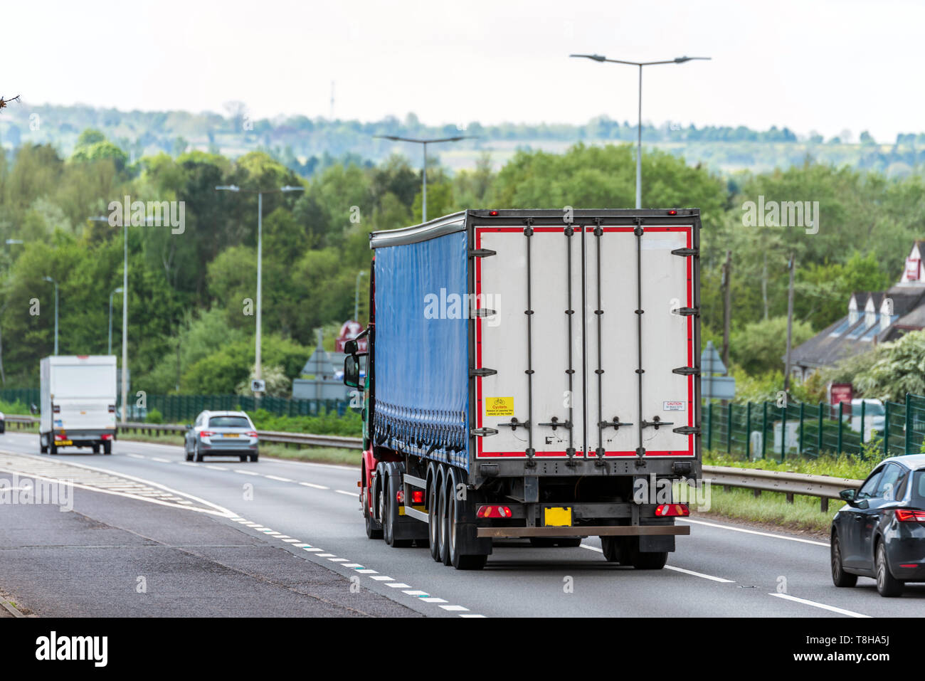 curtain side lorry truck on uk motorway in fast motion Stock Photo
